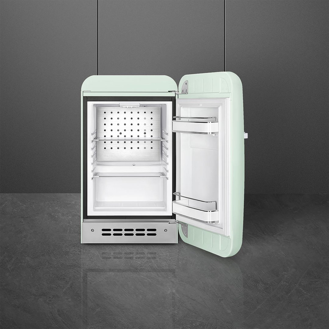 Pastel green retro cooler with door open, showing interior shelves and door bins