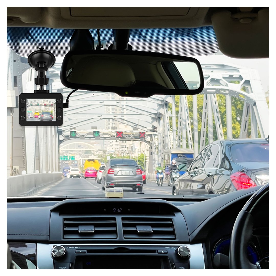 Dash camera mounted on a car windshield, showing traffic on a bridge
