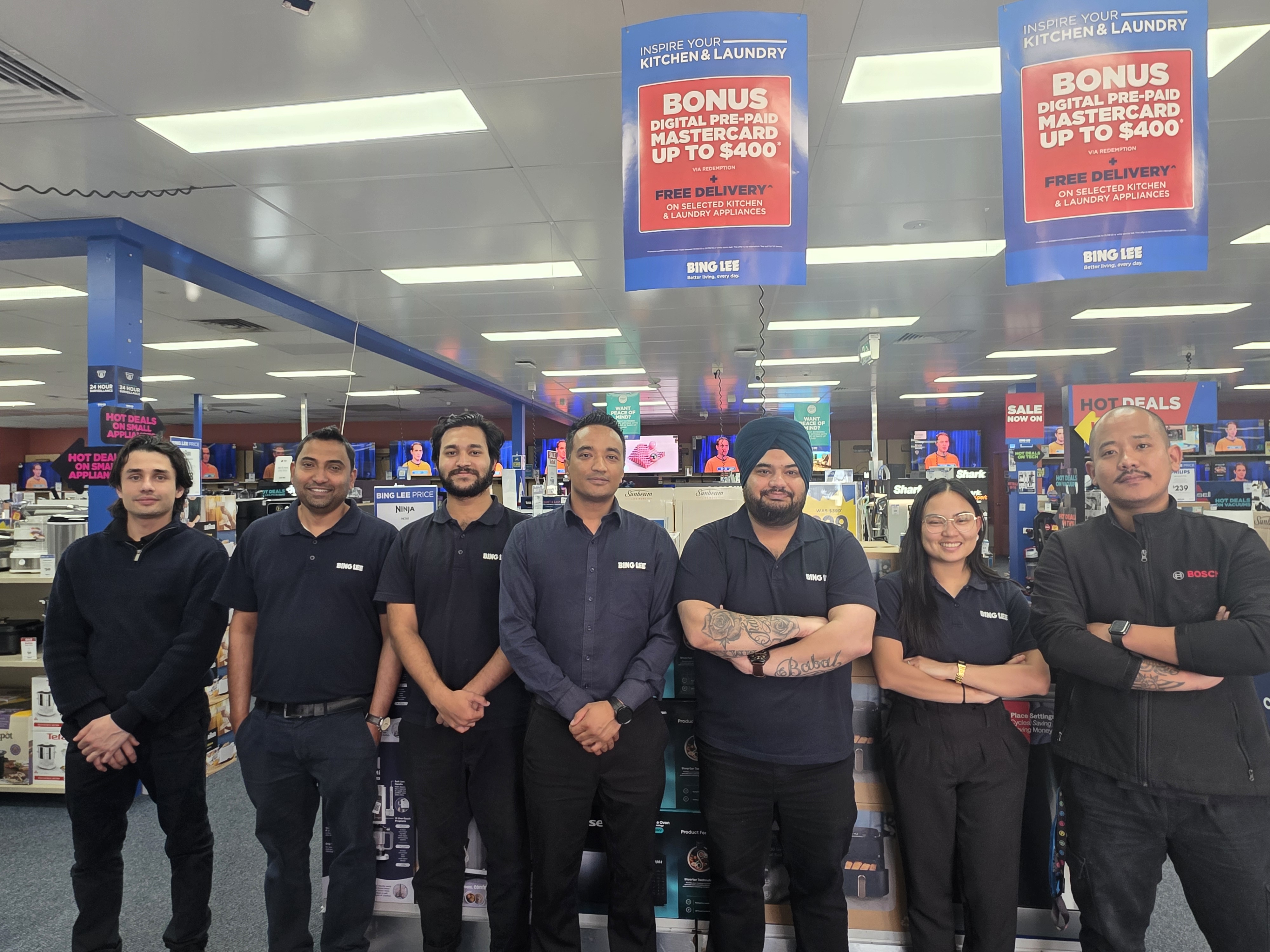 Bing Lee store team smiling in-store